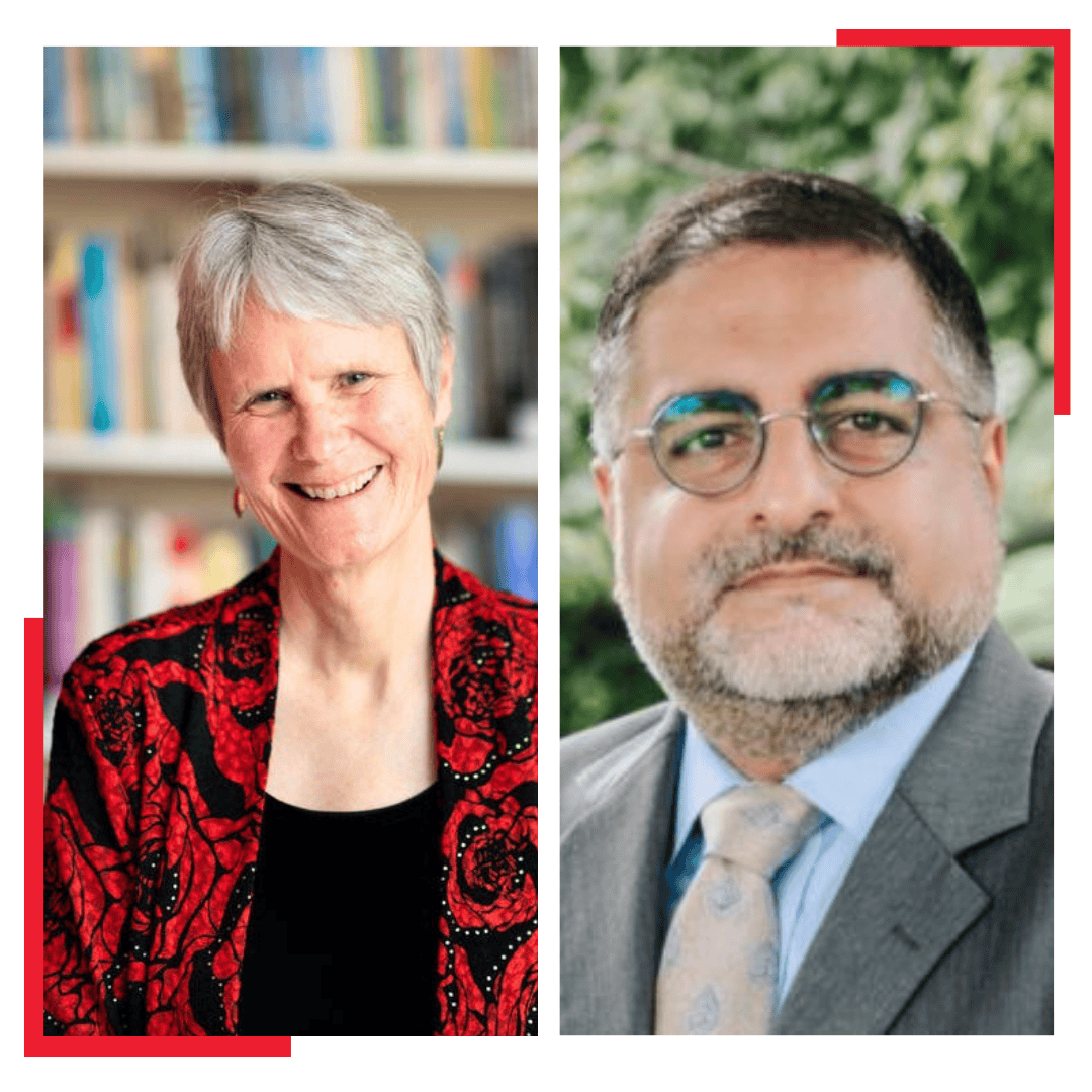 Two people side by side: on the left, an older woman with short gray hair, wearing a red and black patterned jacket, smiling; on the right, a man with glasses, beard, and mustache, wearing a suit and tie, standing outdoors.