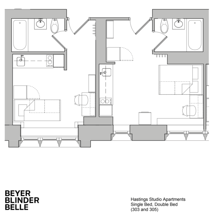Floor plan of 2 different studio apartments. The first can fit a single bed in the same room as the kitchen. There is a desk included. The bathroom is in a separate room. The second apartment is similar but is larger and can fit a double bed instead of a single. 
