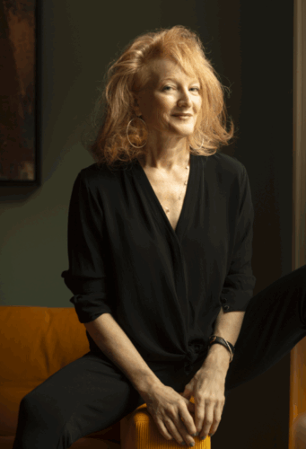 A woman sitting on a chair.