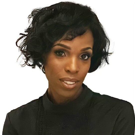 A person with short, curly black hair and an elegant expression is wearing a dark, high-collared outfit against a plain white background.